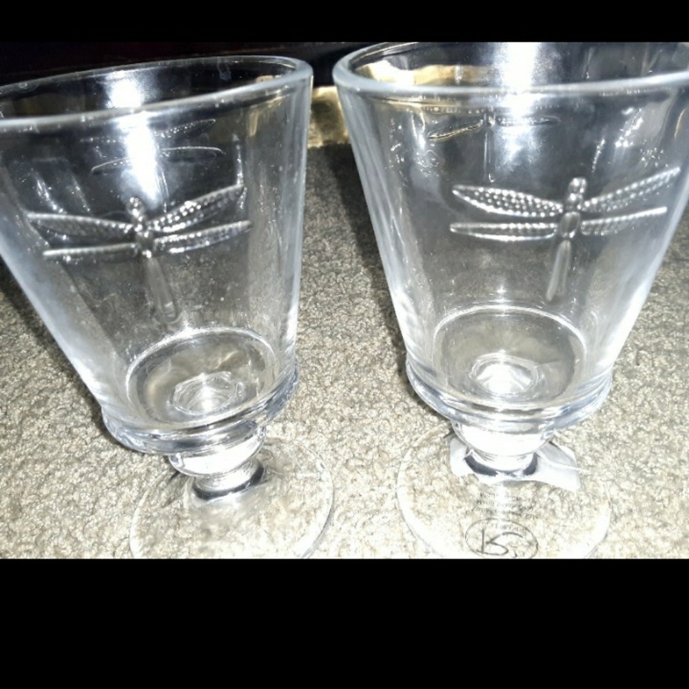 Pair of shirt stem glasses with dragonflies on bot